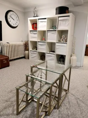 a glass coffee table in front of a book shelf at Private Suite With Private Entrance - Entire Place in Toronto