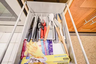 a drawer filled with scissors and other kitchen utensils at Lower-Level Classic House in Richmond Hill in Richmond Hill