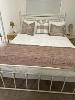 a large bed with pillows on it in a bedroom at Serene Escape Near Niagara Falls - Premium in Thorold