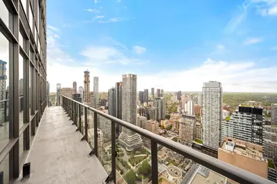 a view of the city from the balcony of a building at Lux Penthouse Retreat Near Yorkville with Parking in Toronto