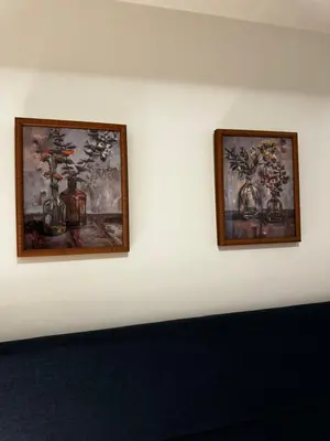 two framed pictures of vases on a wall at Modern 1 bedroom with private bathroom near Toronto airport in Toronto