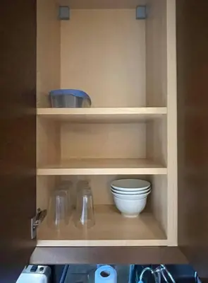 a kitchen cabinet with a bowl and utensils at 2 Bed Apartment in DT Toronto with Free Parking in Toronto
