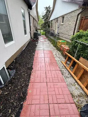a red brick sidewalk in front of a house at The Pantry Suite - Cozy Basement Stay in Mississauga
