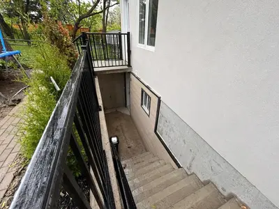 a set of stairs leading up to a house at The Pantry Suite - Cozy Basement Stay in Mississauga