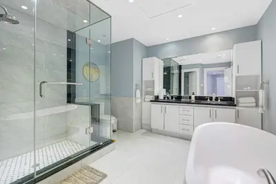 a bathroom with a glass shower and a sink at Modern 3BR Home in Stouffville | Quiet & Spacious in Aurora