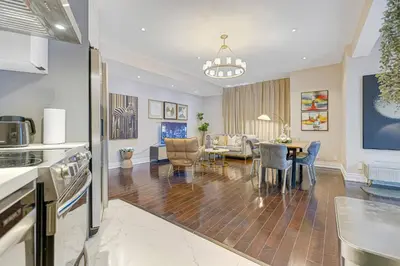 a kitchen and living room with a table and chairs at Modern 3BR Home in Stouffville | Quiet & Spacious in Aurora