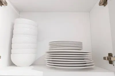 a stack of white plates in a white room at Modern 3BR Home in Stouffville | Quiet & Spacious in Aurora