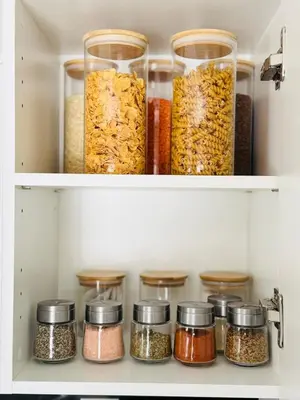 two shelves filled with different types of spices at Designer Escape by the Pond in Kitchener