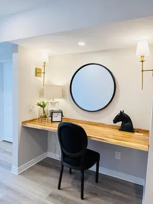a desk with a black chair and a mirror at Designer Escape by the Pond in Kitchener