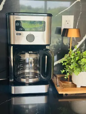 a coffee maker sitting on top of a counter at Designer Escape by the Pond in Kitchener
