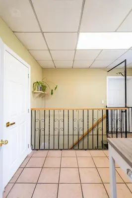 an empty room with a door and a tile floor at Multi-level home near Squareone, Airport, 3Parking in Mississauga