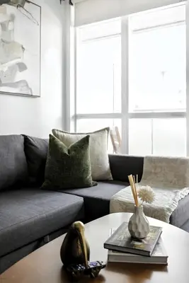 a living room with a couch and a coffee table at Modern CityPlace Retreat King Bed & Balcony in Toronto