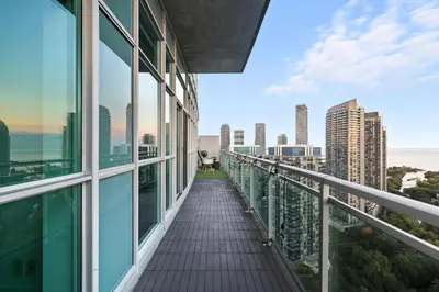 a balcony in a building with a view of the city at Luxury Parklawn Penthouse Breathtaking Lake View in Toronto