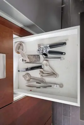 a drawer filled with knives and other kitchen utensils at Modern 1BR in Liberty Village Walk Score 90 in Toronto