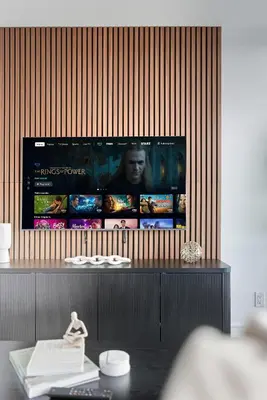 a television on a wall in a room at Chic Bay St Condo Skyline Views 55 TV in Toronto