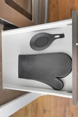 a kitchen drawer with a black appliance inside at Chic Bay St Condo Skyline Views 55 TV in Toronto