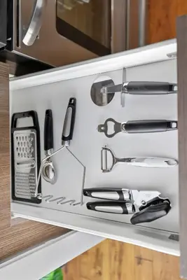 a drawer in a kitchen with cooking utensils at Chic Bay St Condo Skyline Views 55 TV in Toronto