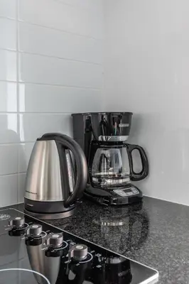 a coffee maker sitting on top of a kitchen counter at Modern Studio Condo High Floor Downtown Toronto in Toronto