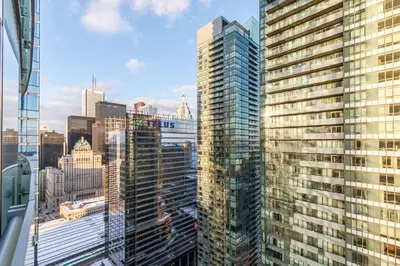 a view of a city skyline with tall buildings at Modern Studio Condo High Floor Downtown Toronto in Toronto