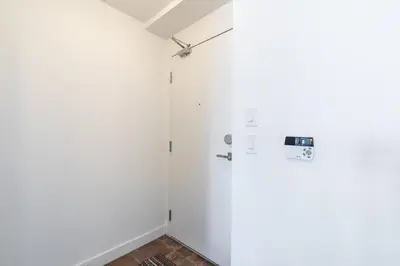 a bathroom with white walls and a shower stall at Modern Studio Condo High Floor Downtown Toronto in Toronto