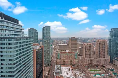 an aerial view of a city with tall buildings at New Cozy 1 Bedroom & Den Condo in Downtown Toronto in Toronto