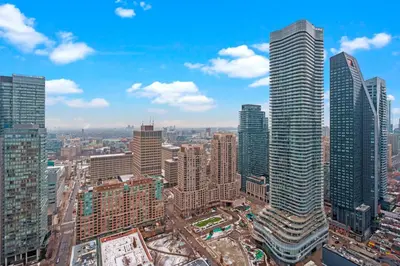 an aerial view of a city with tall buildings at New Cozy 1 Bedroom & Den Condo in Downtown Toronto in Toronto