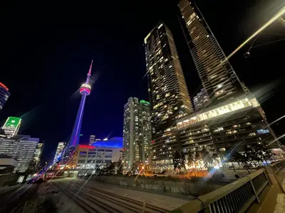 a city skyline at night with the cn tower at Luxury 2 Bedroom 2 Baths Condo Downtown Toronto in Toronto