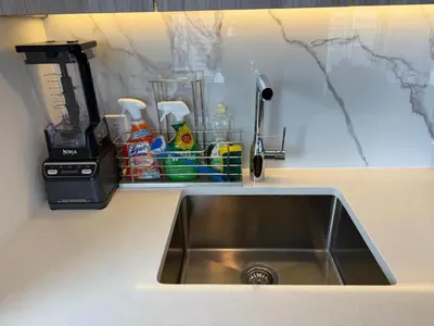 a kitchen counter with a sink and a mixer at Luxury 2 Bedroom 2 Baths Condo Downtown Toronto in Toronto