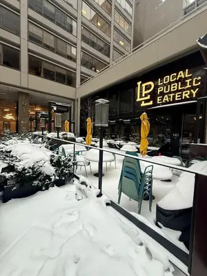 a building with tables and chairs covered in snow at FIFA CENTRAL TORONTO-DIRECT TO BMO FIELD-Live Game Atmosphere-Free Wifi in Toronto