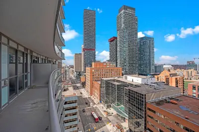 a view of a city skyline with tall buildings at Cozy 2 Bedroom Condo in Dunfield Ave Downtown Toronto in Toronto