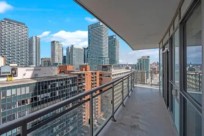 a balcony with a view of a city skyline at Cozy 2 Bedroom Condo in Dunfield Ave Downtown Toronto in Toronto