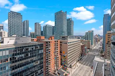 a view of a city with tall buildings at Cozy 2 Bedroom Condo in Dunfield Ave Downtown Toronto in Toronto