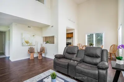 a living room with a couch and a chair at Mountain Home in the Heart of Blue Mountain Village in Blue Mountains