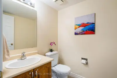 a white bathroom with a sink and a mirror at Mountain Home in the Heart of Blue Mountain Village in Blue Mountains