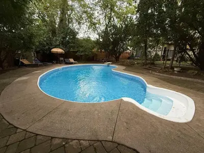 a swimming pool in the middle of a yard at Spacious 4-Bedrooms Friendly House Toronto-Parking in Markham