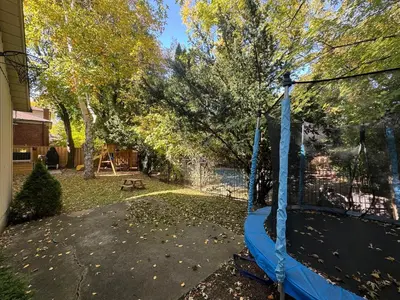a swing in the yard of a house at Spacious 4-Bedrooms Friendly House Toronto-Parking in Markham