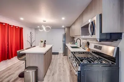 a kitchen with a stove and a counter top at Modern 2BR Unit Near the Falls in Niagara Falls