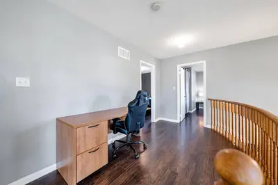 a home office with a desk and a chair at Thrilling Homey Escape In Toronto Area in Ajax