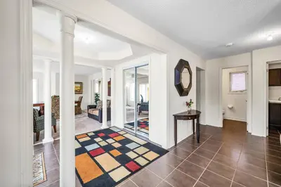 a living room with a hallway with a table at Exhilarating Castle Vibes In Toronto Area in Ajax