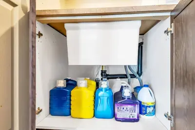 a shelf with different colored bottles on it at Exhilarating Castle Vibes In Toronto Area in Ajax