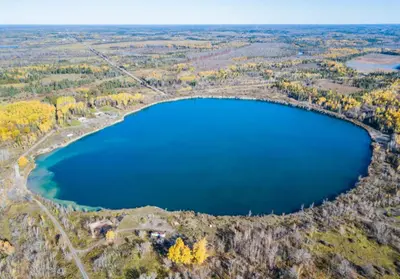 an aerial view of a large lake on a hill at Woodrush Cabin a Charming Lakefront Tiny Cabin in Victoria Road