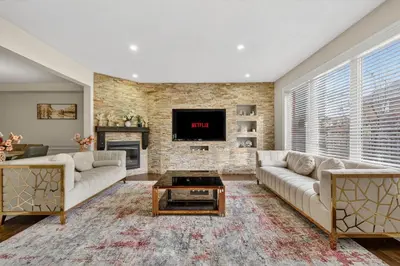 a living room with two couches and a fireplace at Spacious Modern 5BR Home Sleeps 13 Family home in Milton
