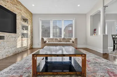 a living room with a couch and a fireplace at Spacious Modern 5BR Home Sleeps 13 Family home in Milton