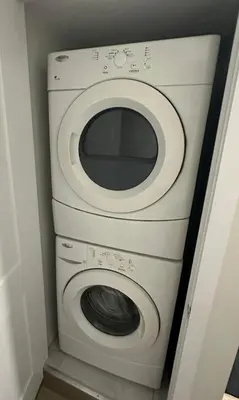 a washer and dryer in a small room at Cozy Basement Studio with Private Bathroom and Kitchen in Vaughan