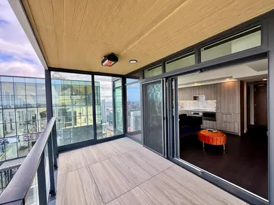 an empty balcony of a building with a desk at Luxury 76 floor 2B2B Downtown Toronto Skyline View in Toronto