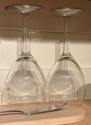 two wine glasses sitting on top of a table at Charming private Guest Suite near Thermea Spa in Whitby