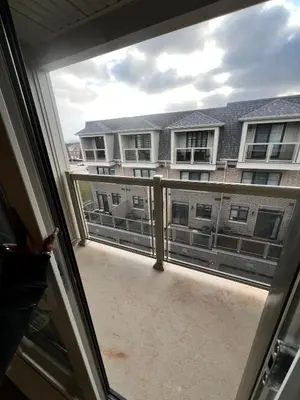 a balcony with a view of a building at Modern Luxury Townhome with 2BR Balcony plus Parking - Happy Oaks in Oakville