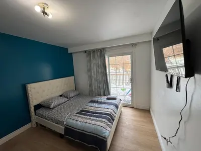 a small bedroom with a bed and a window at Private Room Near Airport D12 in Mississauga