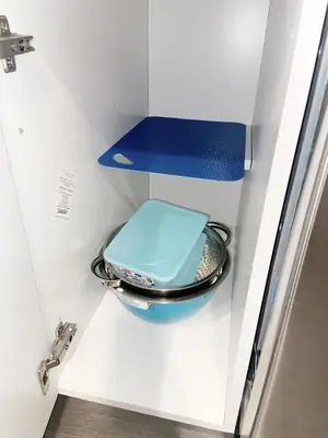 a blue toilet in a drawer in a locker at ClassicPavillion INN in Bowmanville
