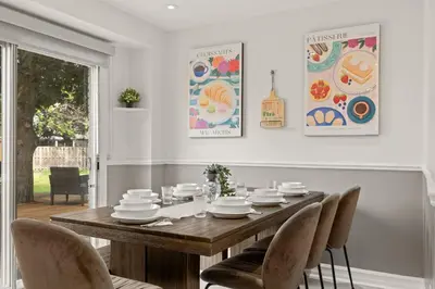 a dining room with a wooden table and chairs at 4BR Family Home - Dog-Friendly, Huge Yard, 5 Beds in Pickering